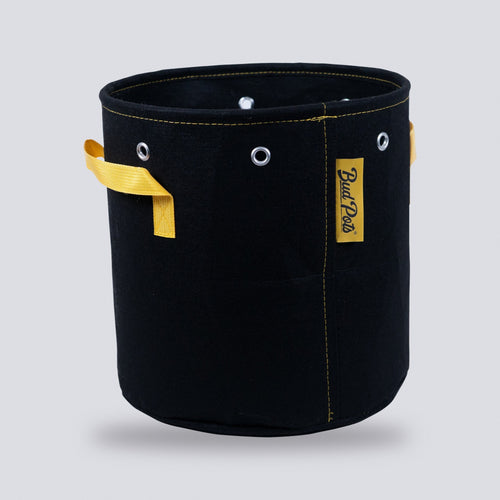5 gallon black fabric grow bag with handles on a grey background