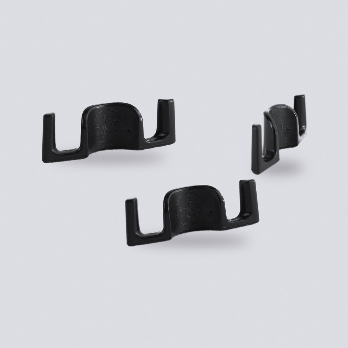 Black plant training clips on a grey background