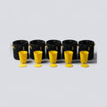 Seed to Pot Set: five yellow seed starting cups with bottom plates in front of five 1 gallon black fabric grow bags
